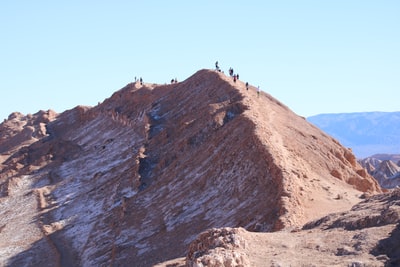 People walking in the mountains during the day
